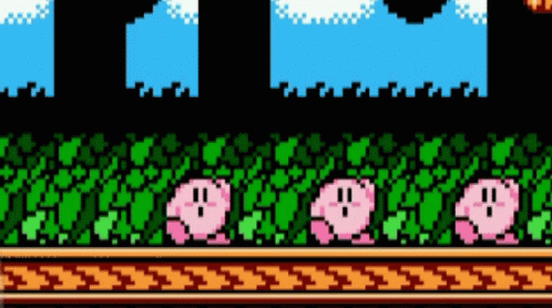 A Video Game Scene With Kirby Standing In The Grass . GIF