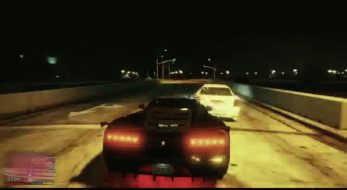 A Video Game Screen Shows A Car Driving Down The Road At Night GIF