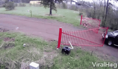 A Video Of A Car Crashing Into A Red Fence With Viralhog Written On The Bottom Right GIF