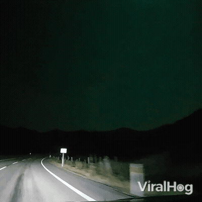 A Video Of A Car Driving Down A Road With The Words Viralhog On The Bottom Right GIF