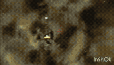 A Video Of A Light Coming Out Of A Hole In The Ground GIF