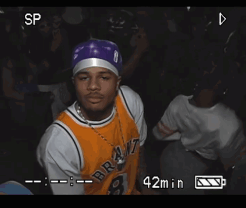 A Video Of A Man Wearing A Bryant Jersey Is Being Recorded GIF