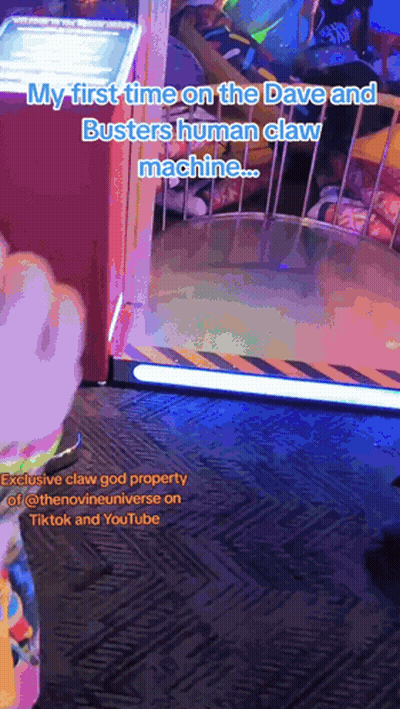 A Video Of A Person Playing A Game Called Busters Human Claw Machine GIF