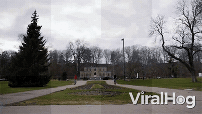 A Video Of People Riding Scooters In A Park With The Words Viralhog At The Bottom GIF