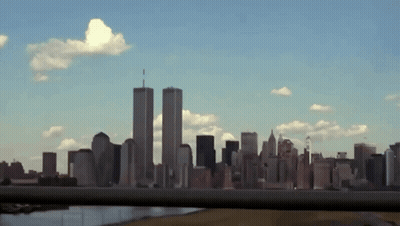 A View Of A City Skyline With The Twin Towers In The Background GIF