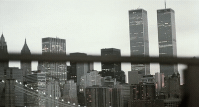 A View Of A City Skyline With The Twin Towers In The Distance GIF