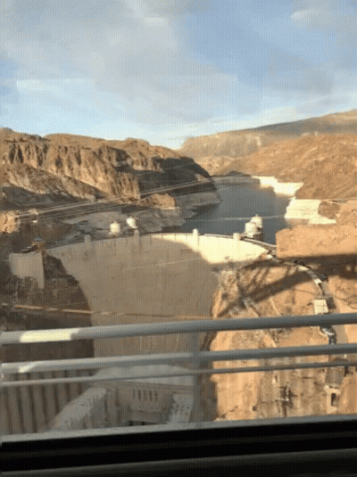 A View Of A Large Body Of Water From A Bridge GIF