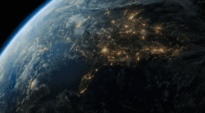 A View Of The Earth From Space At Night With A Lot Of Lights Visible GIF