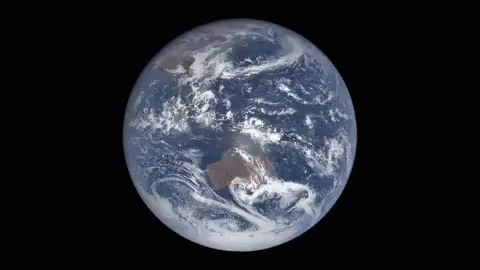 A View Of The Earth From Space With Clouds On It . GIF