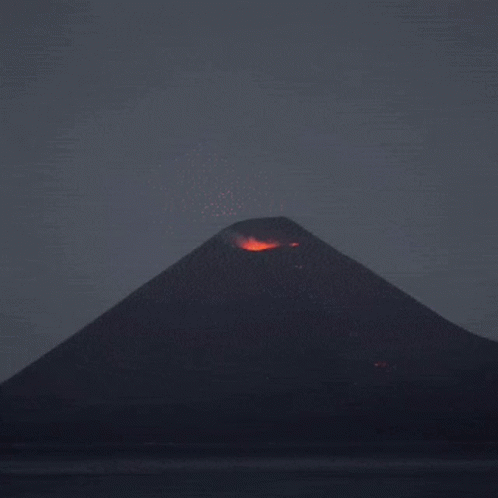 A Volcano Is Erupting With A Lot Of Flames GIF