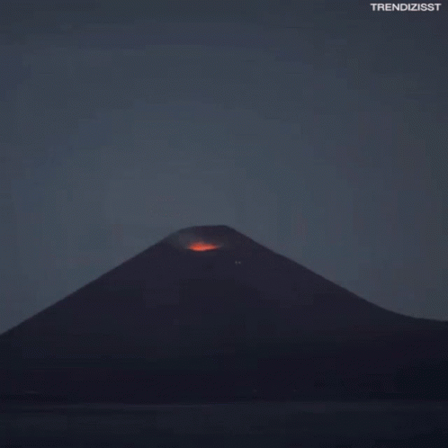A Volcano Is Erupting With The Hashtag Trendizisst On The Bottom GIF