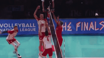 A Volleyball Game Is Being Played In Front Of A Sign That Says Volleyball Nation League GIF