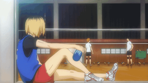 A Volleyball Player Sits On The Floor With A Bottle Of Water In His Hand That Says ' Mizuno ' On It GIF