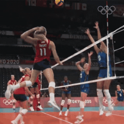 A Volleyball Player Wearing Number 11 Jumps In The Air GIF