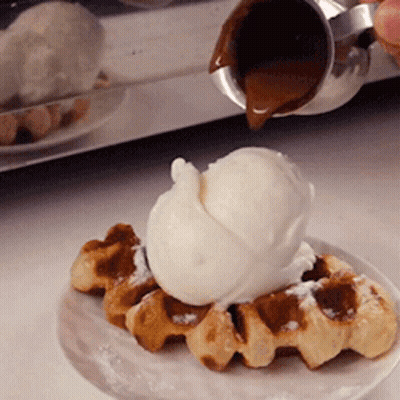 A Waffle With A Scoop Of Ice Cream On It GIF