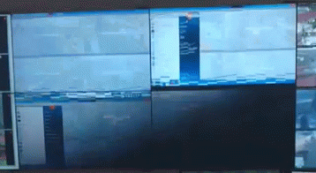 a wall of monitors with one that says ' nbc ' on the bottom
