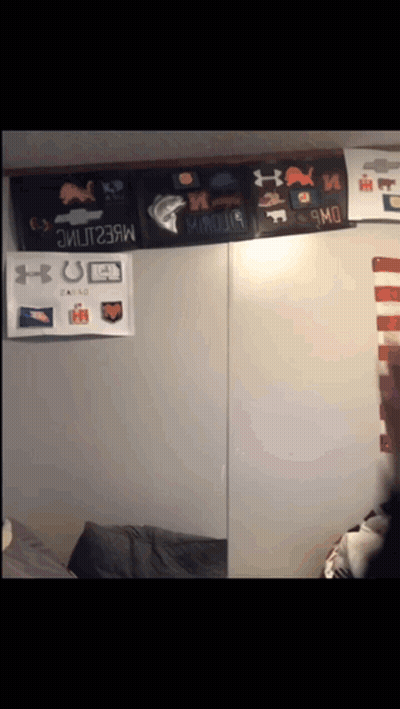A Wall With A Bunch Of Under Armour Posters On It GIF