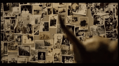 A Wall With A Lot Of Pictures On It And One Of Them Says ' A ' On It GIF