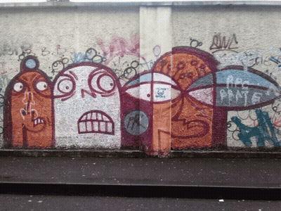 A Wall With Graffiti On It Including A Sticker That Says ' A Few Boys ' GIF