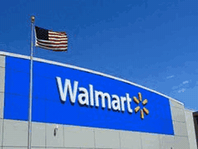 A Walmart Store With People Standing Outside In Front Of It GIF