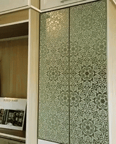 A Wardrobe With A Floral Pattern On The Door GIF