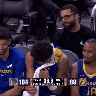 A Warriors Player Wipes His Face With A Towel During A Game GIF