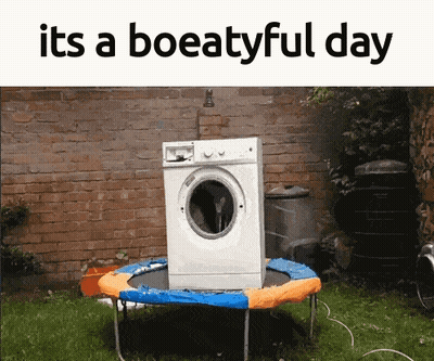 A Washing Machine Sitting On Top Of A Trampoline With The Words " Its A Boeatyful Day " Above It GIF