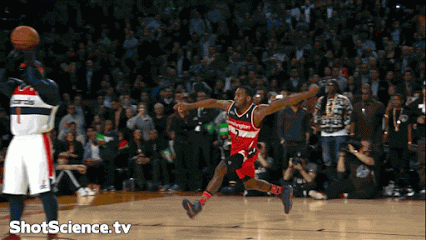 A Washington Wizards Basketball Player Is Jumping In The Air To Catch A Basketball GIF