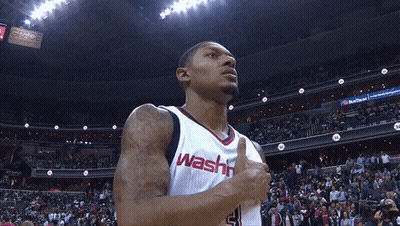 A Washington Wizards Player Giving A Thumbs Up In Front Of A Crowd GIF