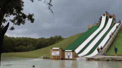 A Water Slide Has A Sign That Says Rapid Flash GIF