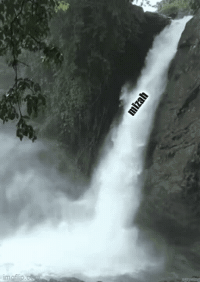 A Waterfall In The Woods With The Word Mitzah On It . GIF