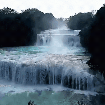 A Waterfall Is Surrounded By Trees And A White Background With The Word Art On The Bottom Right GIF