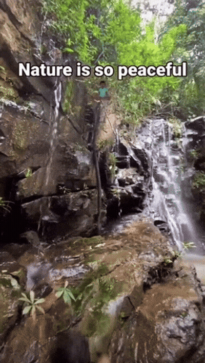A Waterfall With The Words Nature Is So Peaceful GIF