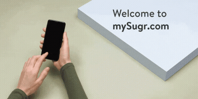 A Welcome To Mysugr.com Sign With A Person Using A Cell Phone GIF