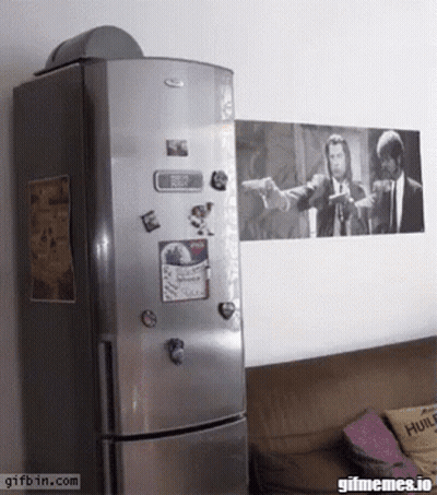 A Whirlpool Refrigerator With A Picture Of Pulp Fiction On The Wall GIF
