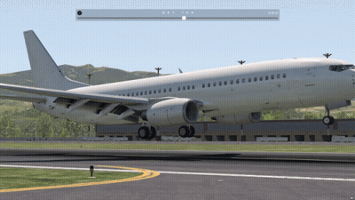 A White Airplane Is Sitting On A Runway With Mountains In The Background And A Pause Button On The Bottom Right GIF