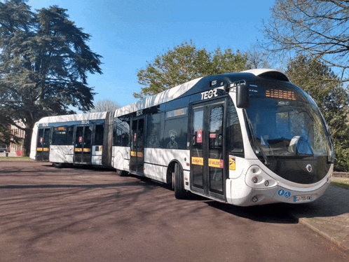 A White And Black Bus With The Number Tegr On The Front GIF