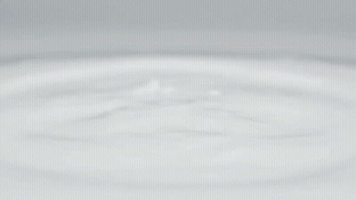 a white apple iphone is floating on a white surface