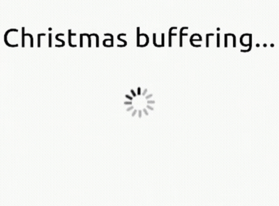 A White Background With The Words `` Christmas Buffering ... '' And A Loading Spinner . GIF