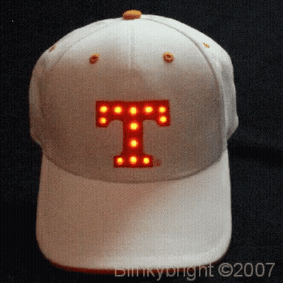 A White Baseball Cap With The Letter T Lit Up GIF