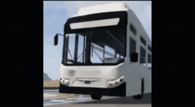 A White Bus Is Driving Down A Road GIF