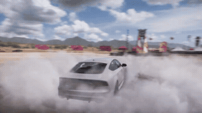 A White Car Is Drifting On A Dirt Road With Smoke Coming Out Of It GIF