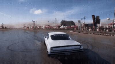 A White Car Is Driving Down A Dirt Road With A Sign That Says ' R ' On It GIF
