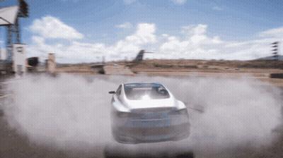 A White Car Is Driving Down A Dirt Road With Smoke Coming Out Of It GIF