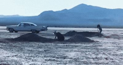 A White Car Is Parked On The Side Of A Desert Road GIF