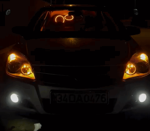 A White Car With A License Plate That Says 34Da 0476 GIF