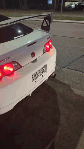 A White Car With A License Plate That Says Era-53E GIF
