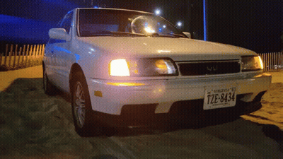 A White Car With A Virginia License Plate That Says Tze-8434 GIF