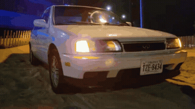 A White Car With A Virginia License Plate Tze-8434 GIF