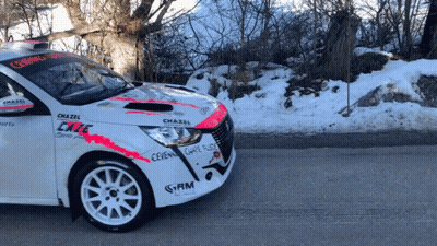 A White Car With Chazel Written On The Side GIF